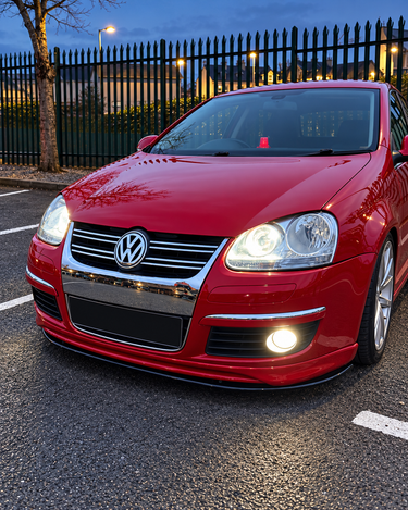 VW Jetta Mk5 gloss black front splitter, angled view